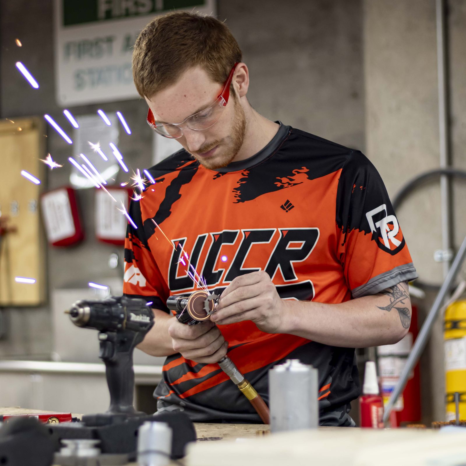 A UCCR member fabricating robot parts